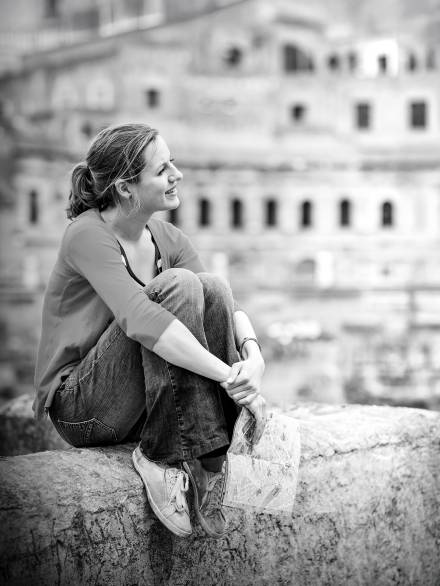 Portrait of a pretty, young, female tourist in Rome, Italy (with Colosseum in the background)